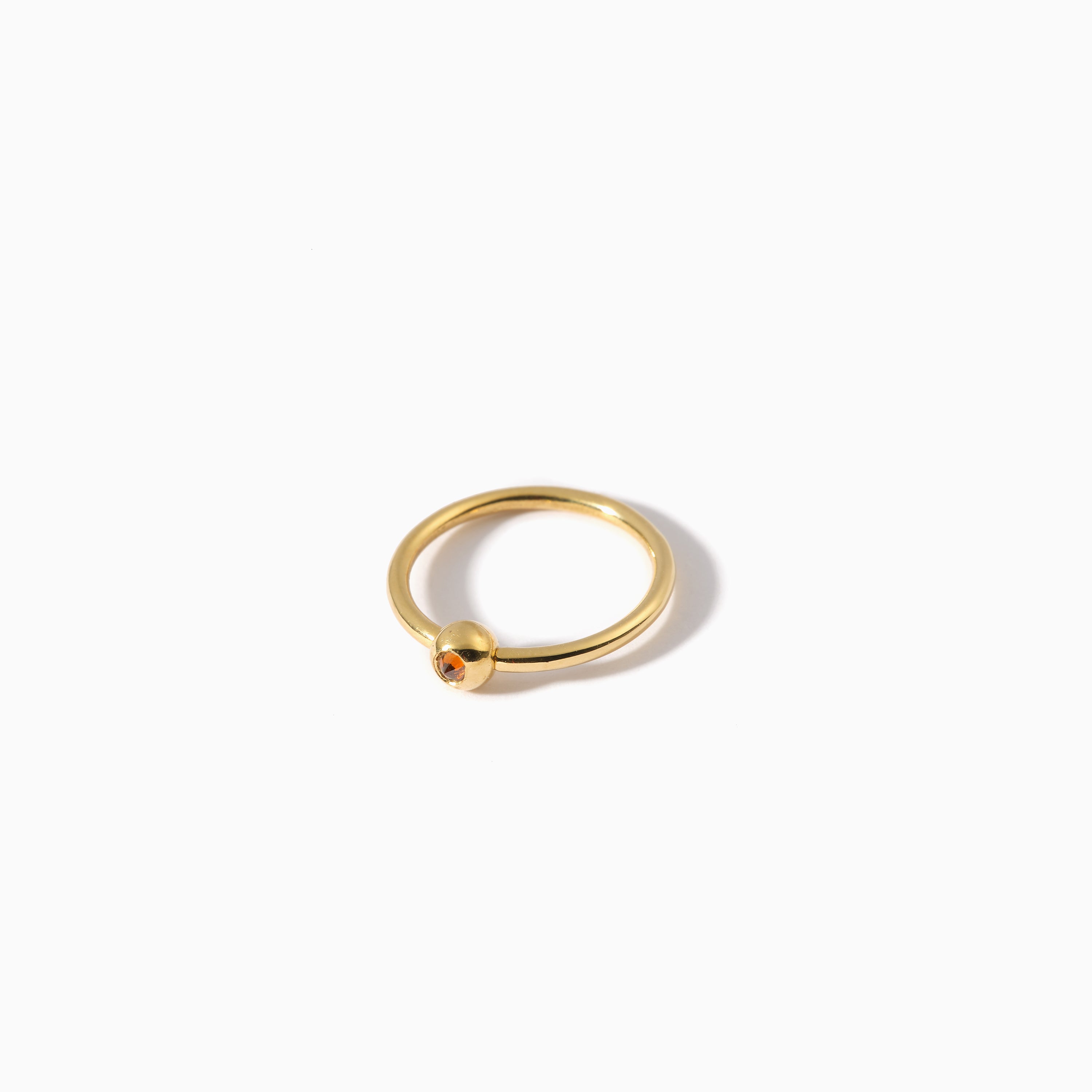 Studded Teardrop Captive Ring 16G L Cognac